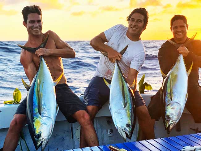 Three men all holding caught yellow fin tuna - Are you ready to go fishing with Aloha Kauai Sportfishing